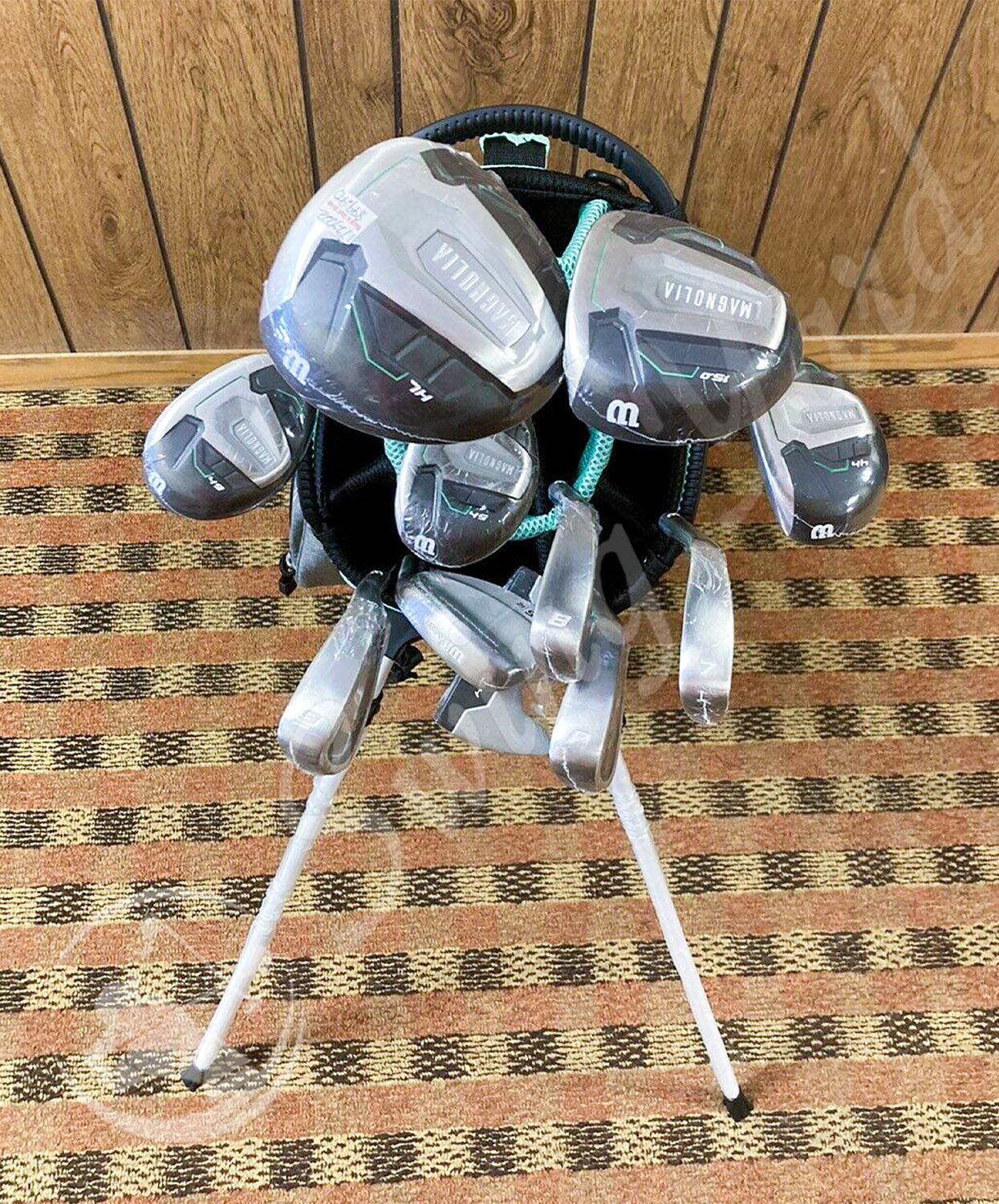 The set of Wilson Magnolia with golf bag in the house